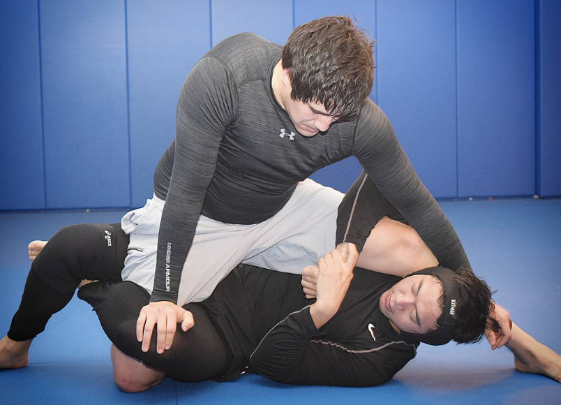 Two students training No-Gi Jiu Jitsu submission grappling on the mats at Caveirinha Jiu Jitsu Family Santa Monica